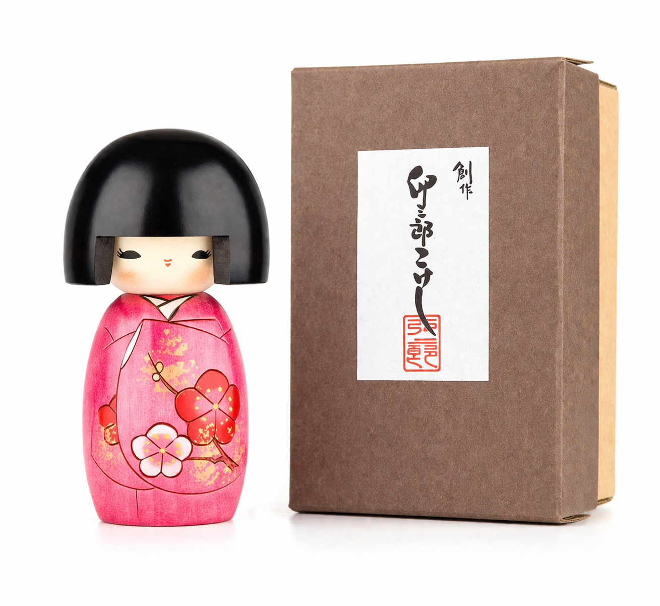Traditional handmade Kokeshi doll with pink blossom design made in Japan