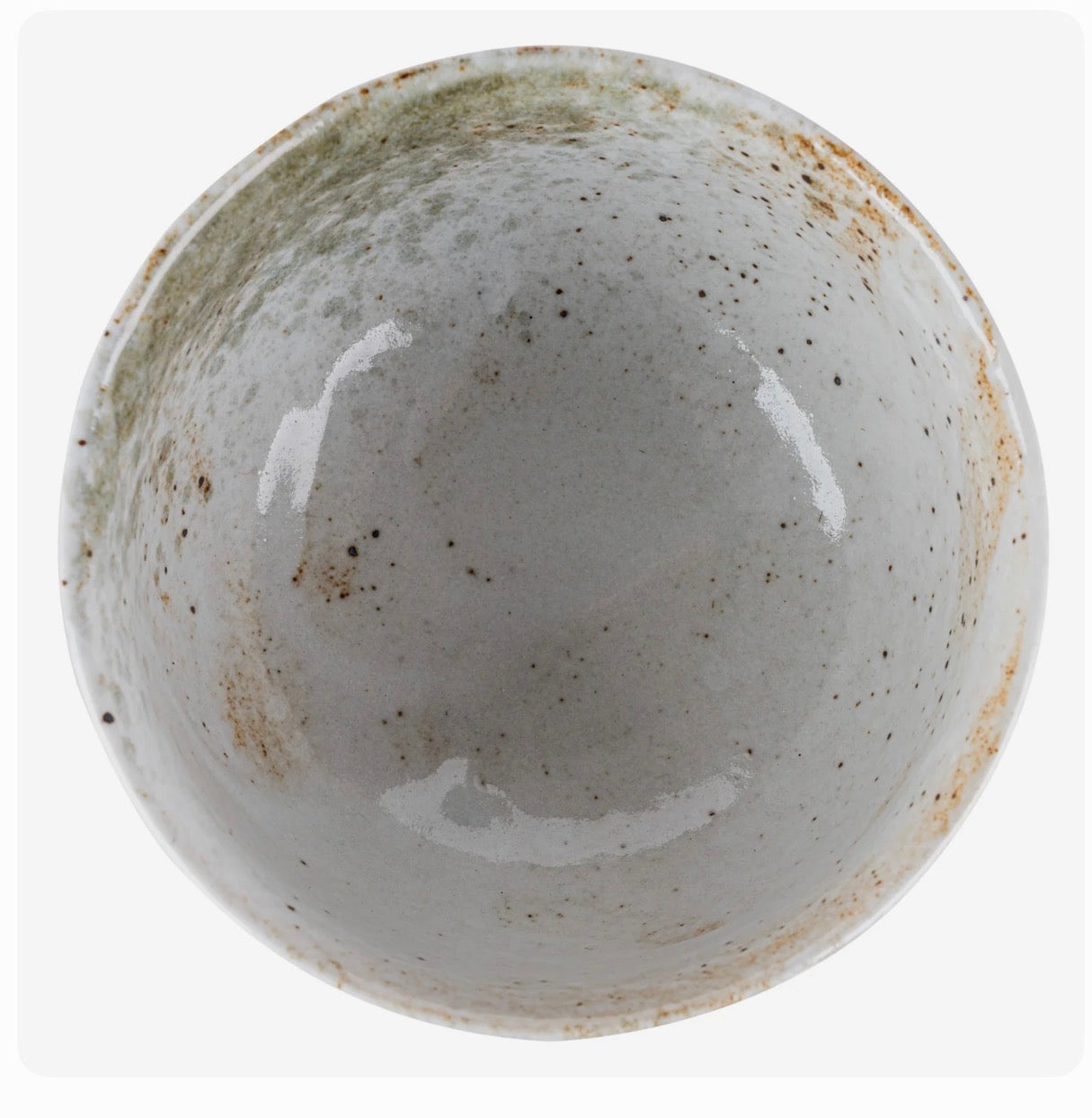 Yukishino handmade Japanese matcha bowl with white glaze and natural earthy brown and grey tones.