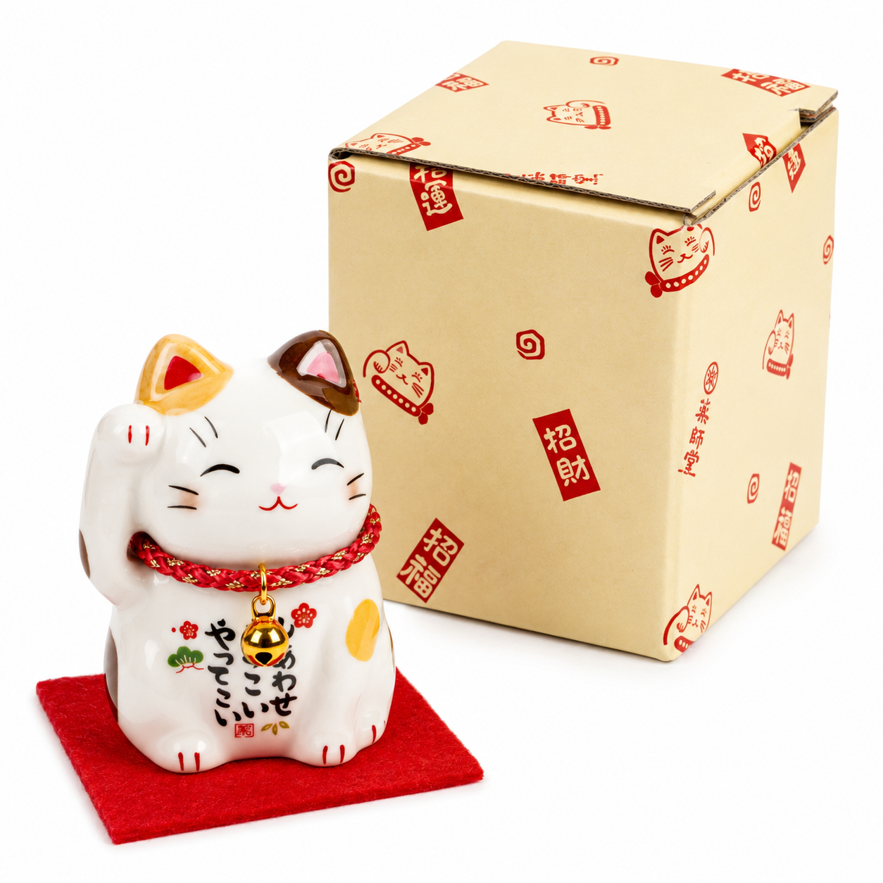 Traditional Japanese Maneki Neko lucky cat ornament with raised right paw, decorative red cord, gold bell,  and presentation gift box, made in Japan