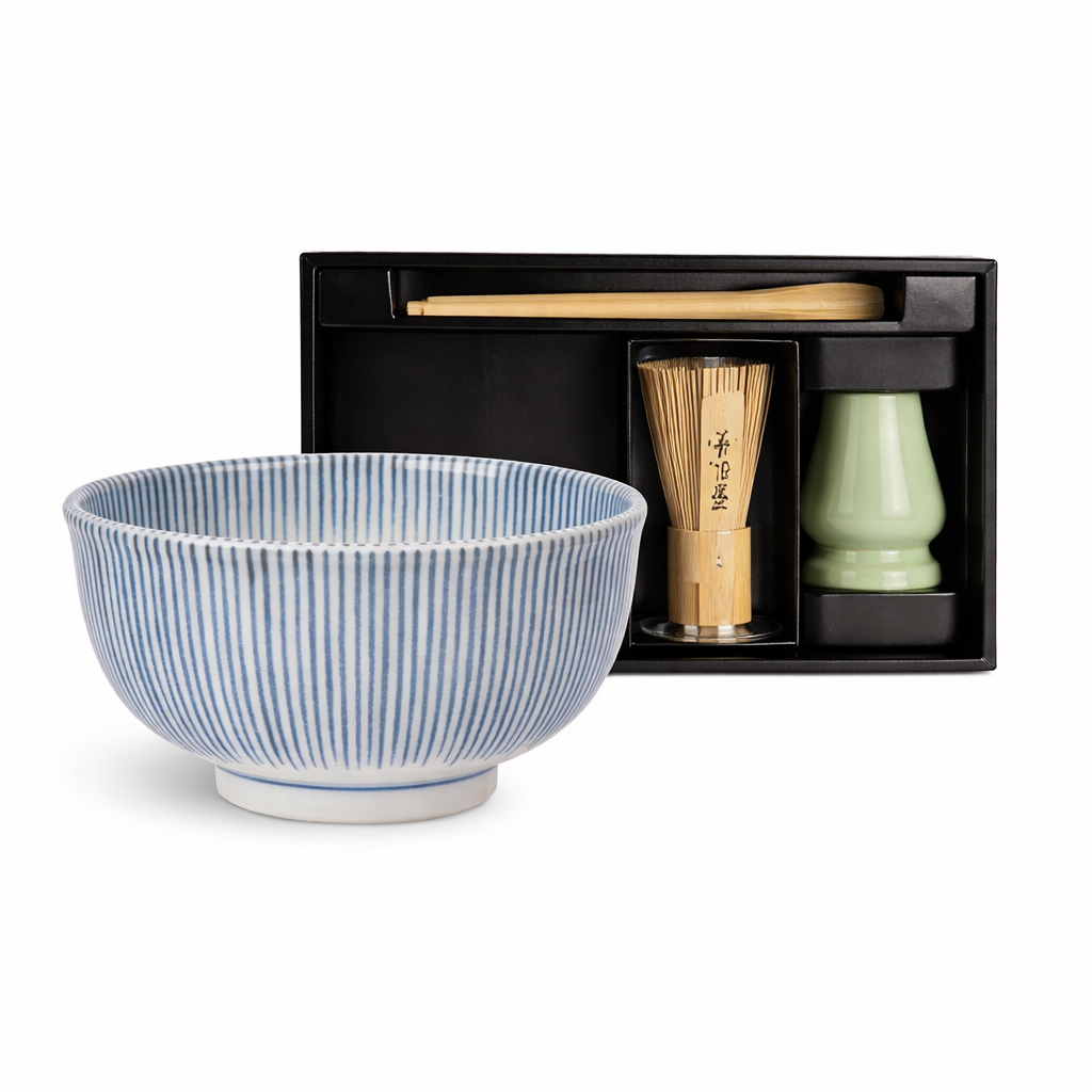 Authentic Japanese matcha tea set featuring a handcrafted Tokusa ceramic bowl with elegant blue line pattern and traditional tea tools