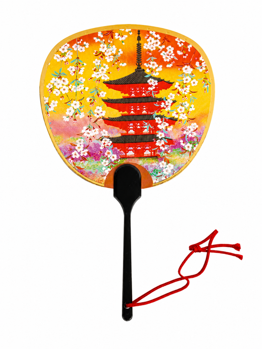 Fan front view — pagoda, cherry blossoms, gold/orange background, red cord