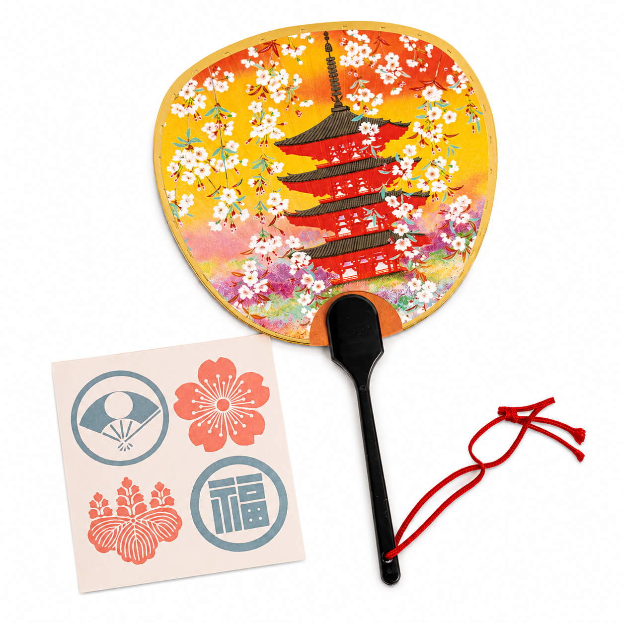  Flat lay — fan + red cord + Japanese mon crest sticker sheet (fan, plum blossom, wisteria, 福 fuku kanji
