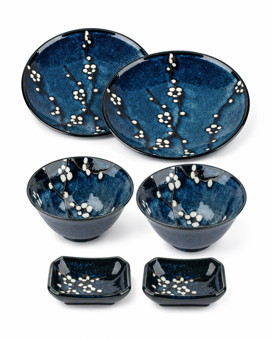 Blue Hana Japanese Dinner Set for two — authentic Japanese porcelain in deep blue with white cherry blossom pattern, showing plates, rice bowls and dipping dishes, made in Japan
