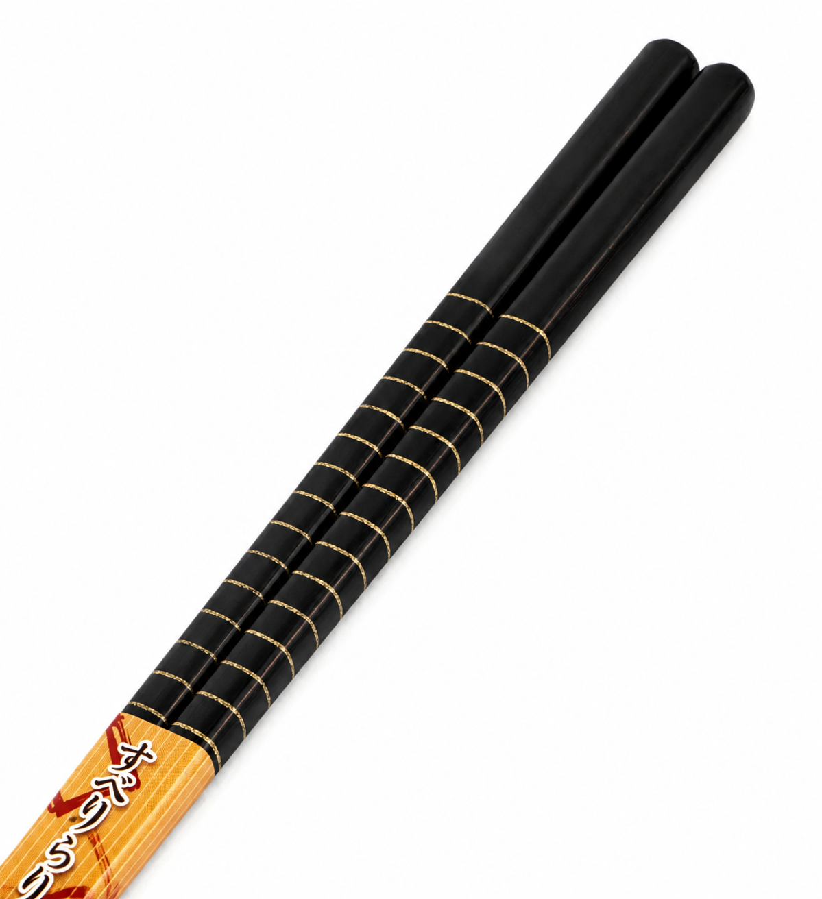 Close-up of black and gold striped handle on Japanese cooking chopsticks — bamboo saibashi made in Japan