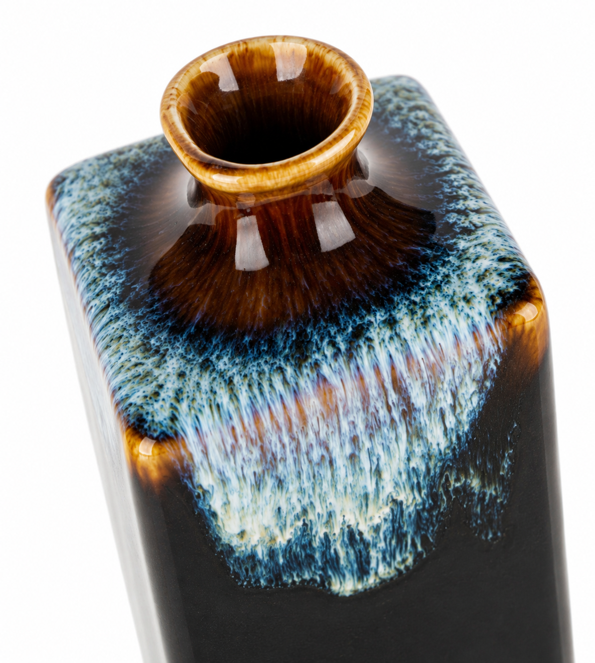 Close-up of Yoru sake jug neck showing amber and blue drip glaze detail on black ceramic rectangular tokkuri, made in Japan