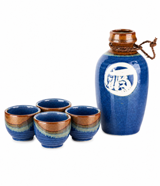 Kamakura Premium Japanese Sake Set – indigo blue ceramic sake jug and four cups with amber and blue layered glaze, kanji 酒 on front, made in Japan
