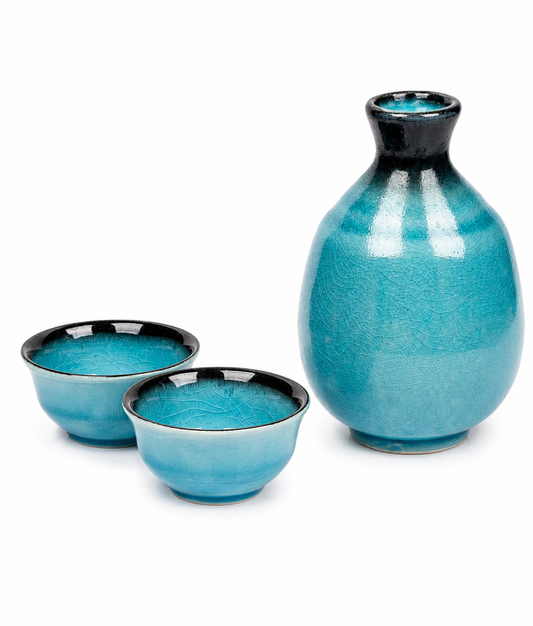 Sea Blue Crackle Glaze Japanese Sake Set – teal ceramic tokkuri sake jug and two cups with black rim detail, crackle glaze finish, made in Japan