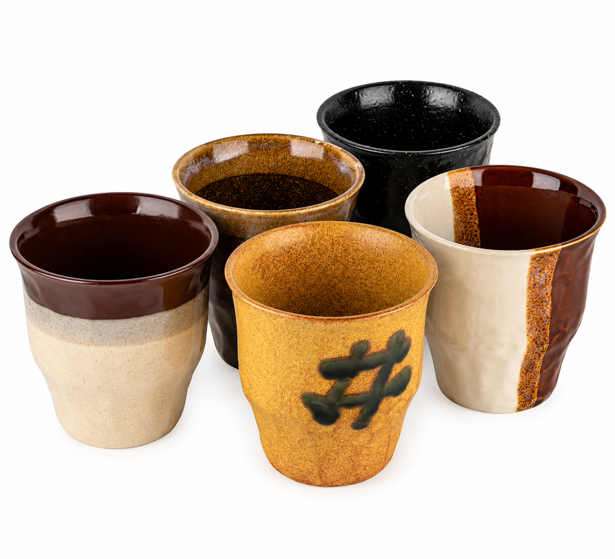 Five Japanese ceramic cups in cream, brown, ochre and speckled black, grouped together on a white background.