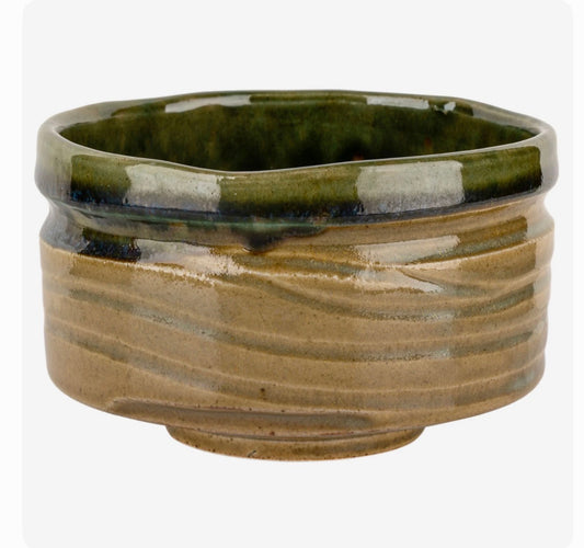 Handmade Kizeto Oribe Japanese matcha tea bowl with yellow and green ceramic glaze, crafted in Japan.