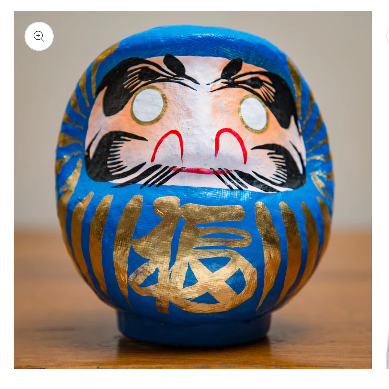 Blue daruma doll.