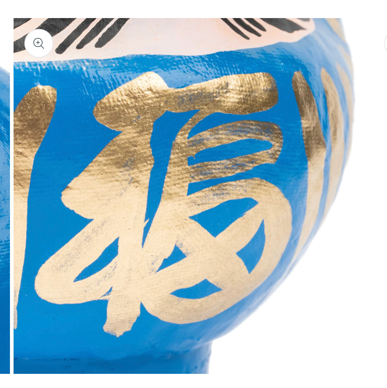 Blue daruma doll.